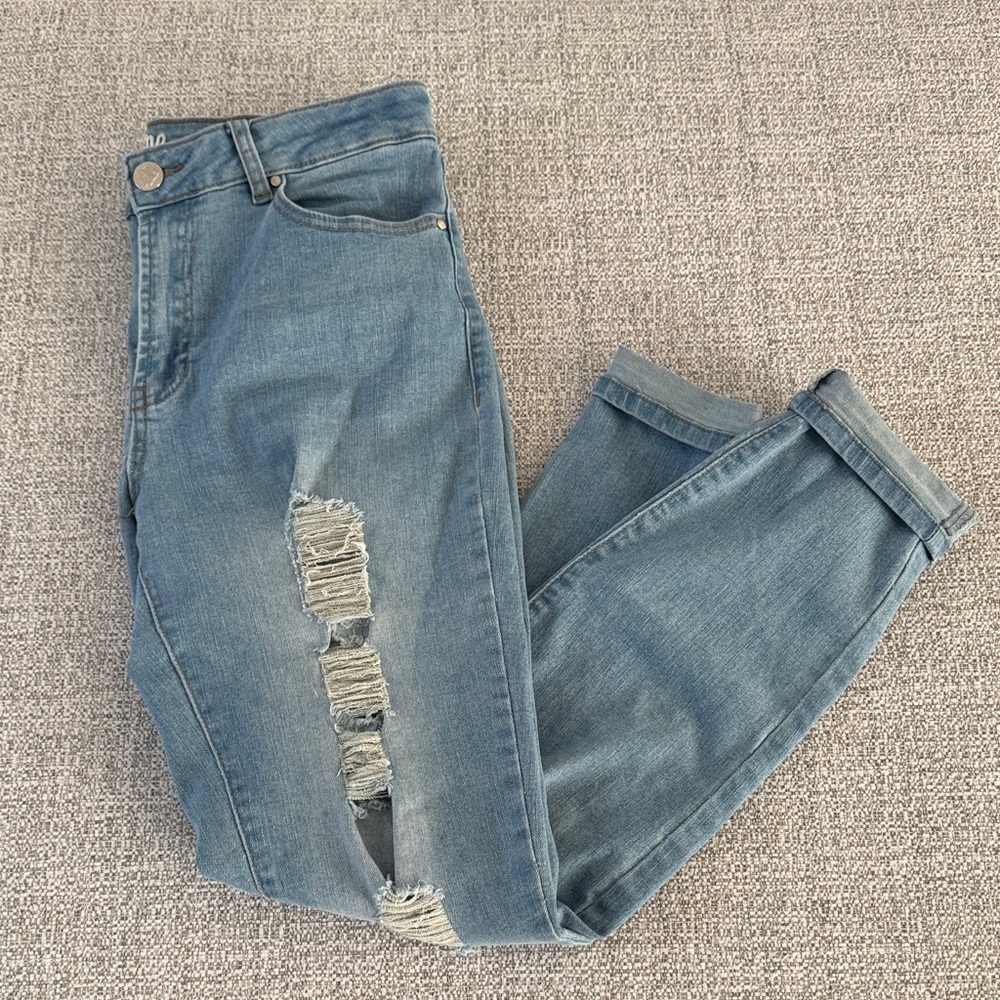 Distressed stretchy blue jeans